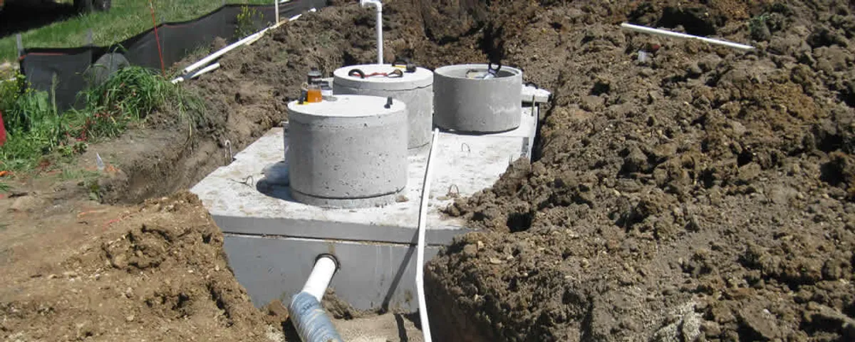 Septic system repair and installation site with tank access ports in Madison, WI
