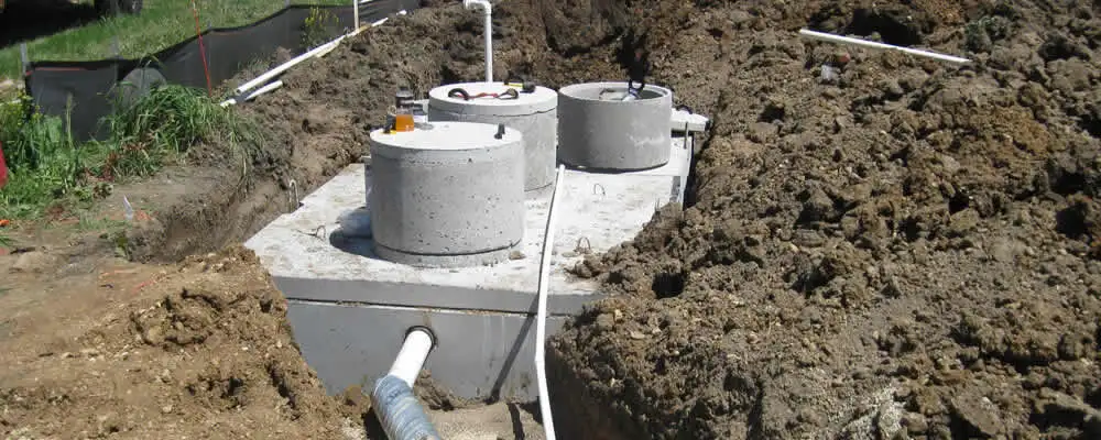 Septic system repair and installation site with tank access ports in Madison, WI