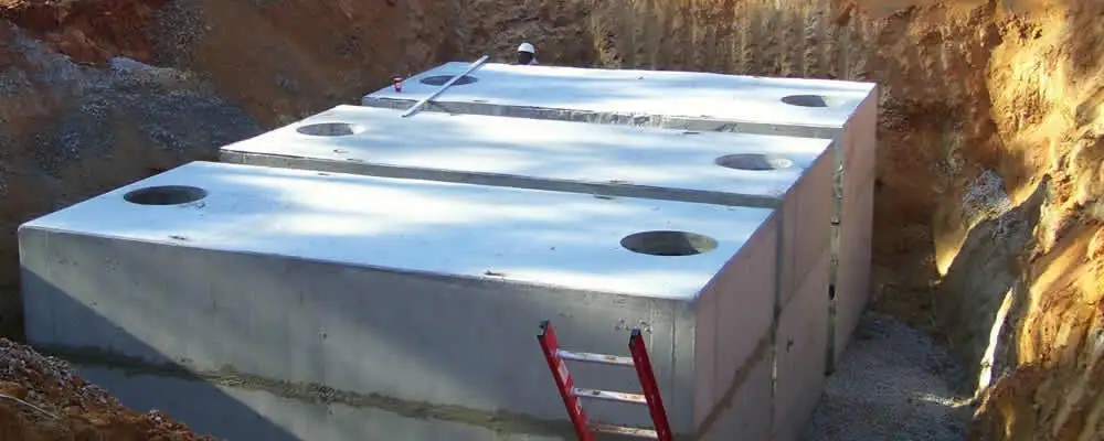 Septic tank installation site with a newly placed concrete tank in Madison, WI